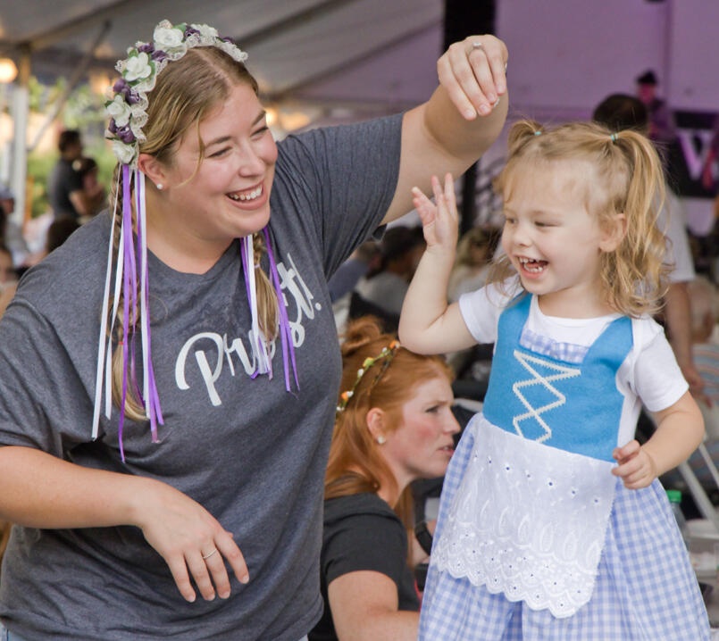 Woman and young girl dancing at Germanfest Picnic